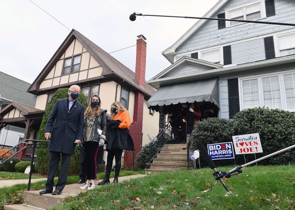 PHOTO: FILE - Democratic presidential candidate Joe Biden visits his childhood home with his granddaughters in Scranton, Pa., Nov. 3, 2020.