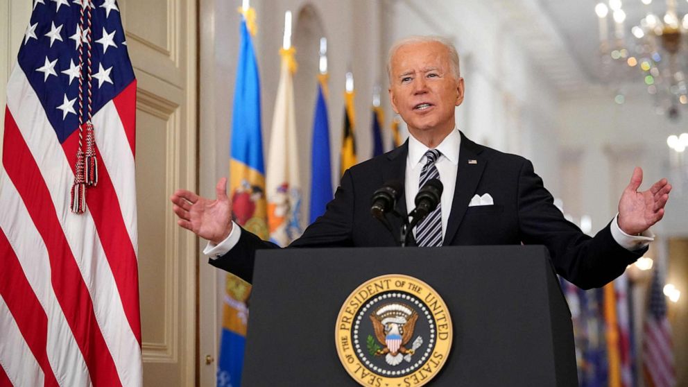 PHOTO: President Joe Biden gestures as he speaks on the anniversary of the start of the COVID-19 pandemic, in the East Room of the White House in Washington, D.C., on March 11, 2021.