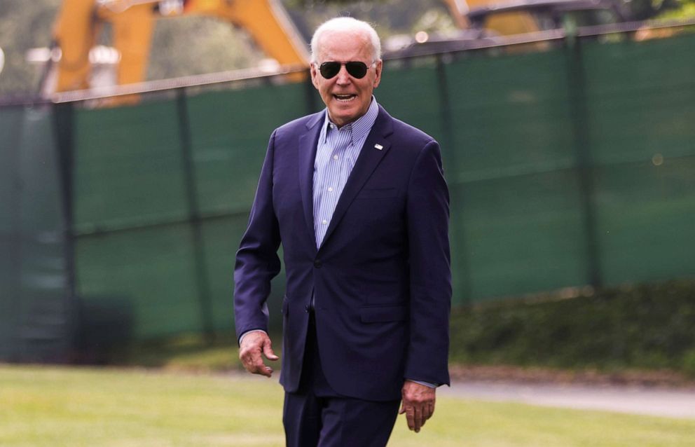 PHOTO: President Joe Biden responds to reporters as he walks to Marine One to depart for Cincinnati from the South Lawn of the White House in Washington, July 21, 2021.