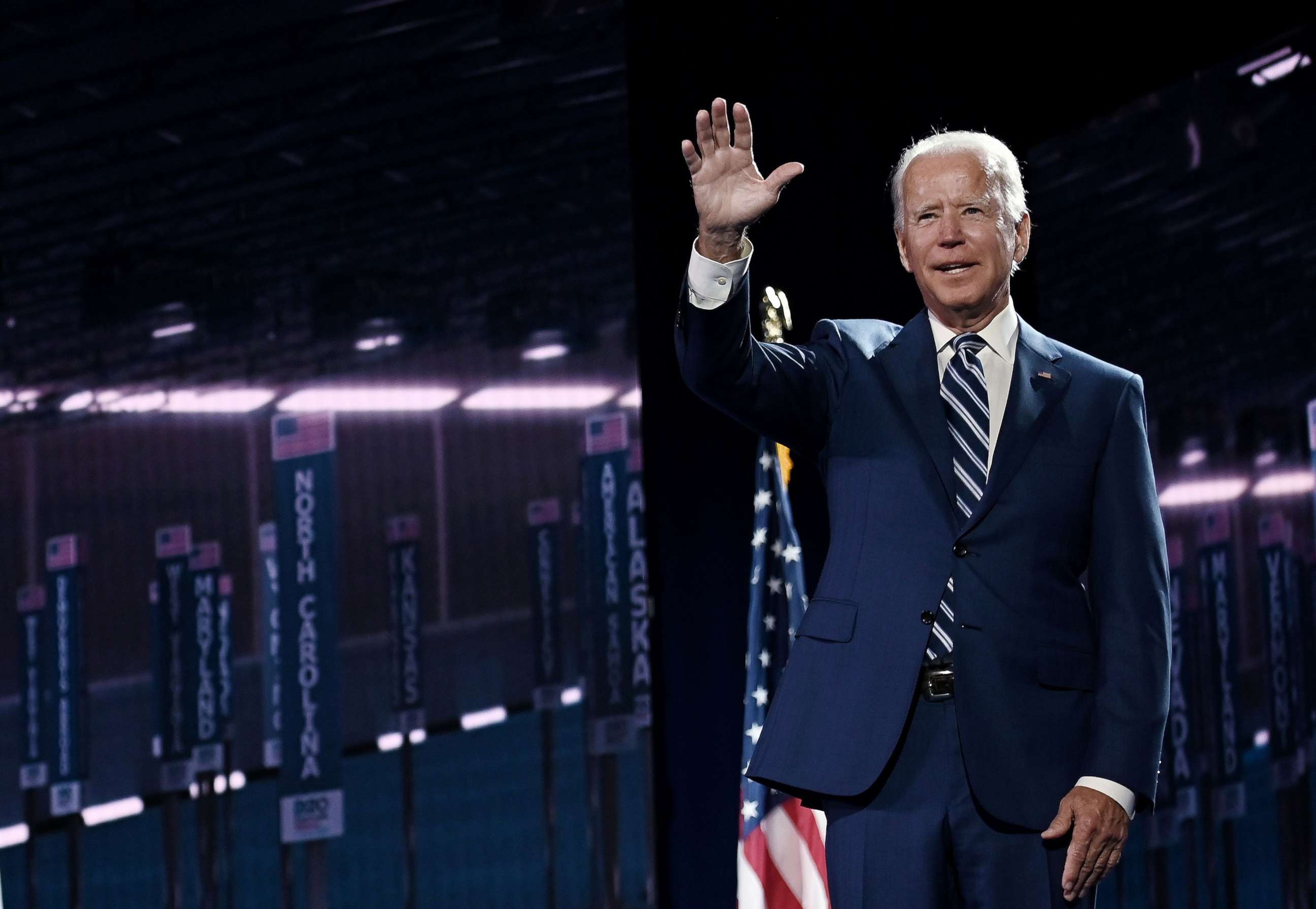 PHOTO: Former vice president and Democratic presidential nominee Joe Biden waves on stage at the end of the third day of the Democratic National Convention at the Chase Center in Wilmington, Del., on Aug. 19, 2020.