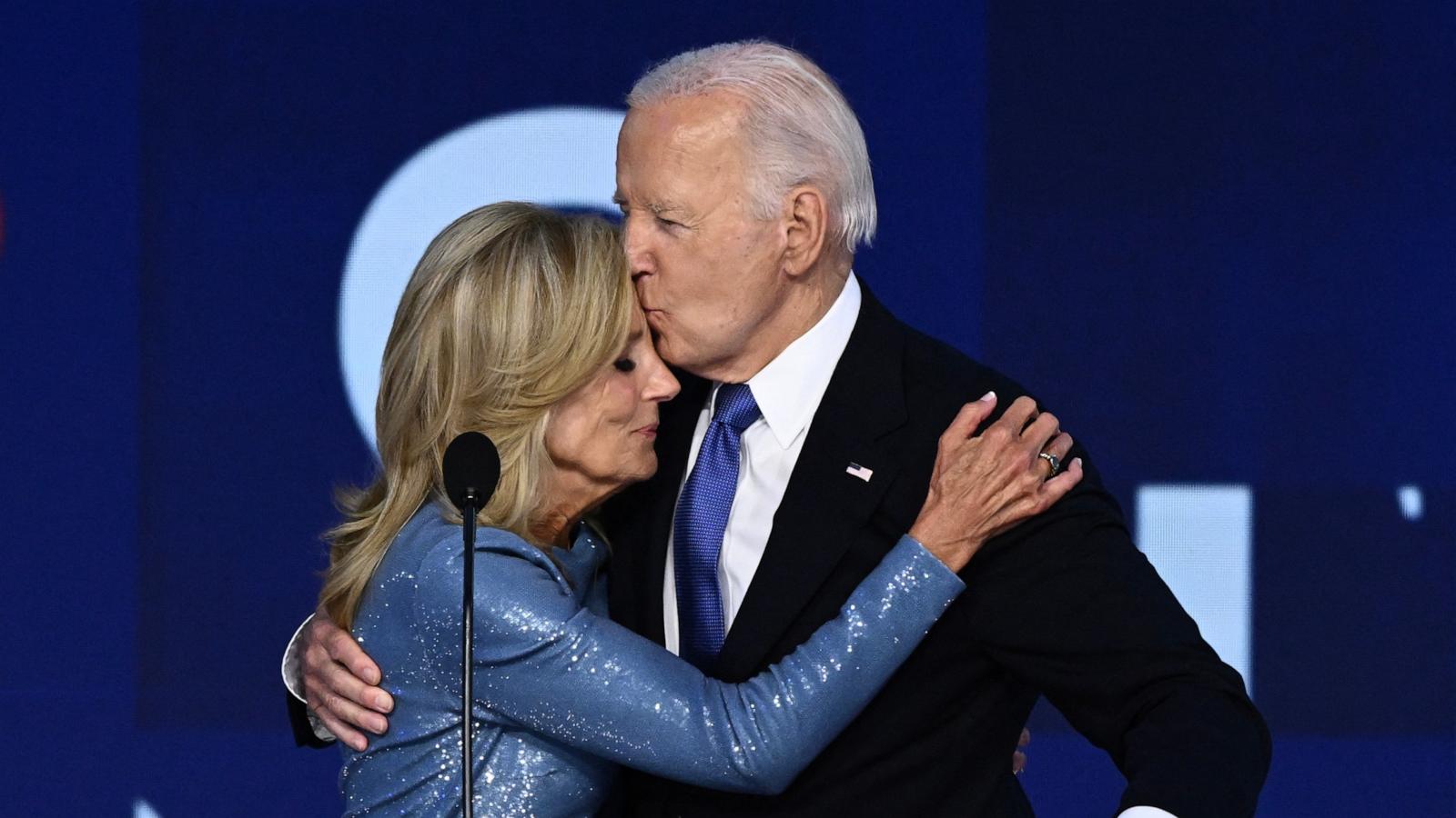 President Joe Biden kisses his wife First Lady Jill Biden after he gave the keynote address on the first day of the Democratic National Convention (DNC) at the United Center in Chicago, Illinois, on August 19, 2024.