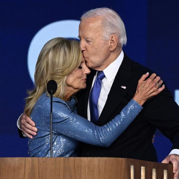 President Joe Biden kisses his wife First Lady Jill Biden after he gave the keynote address on the first day of the Democratic National Convention (DNC) at the United Center in Chicago, Illinois, on August 19, 2024.