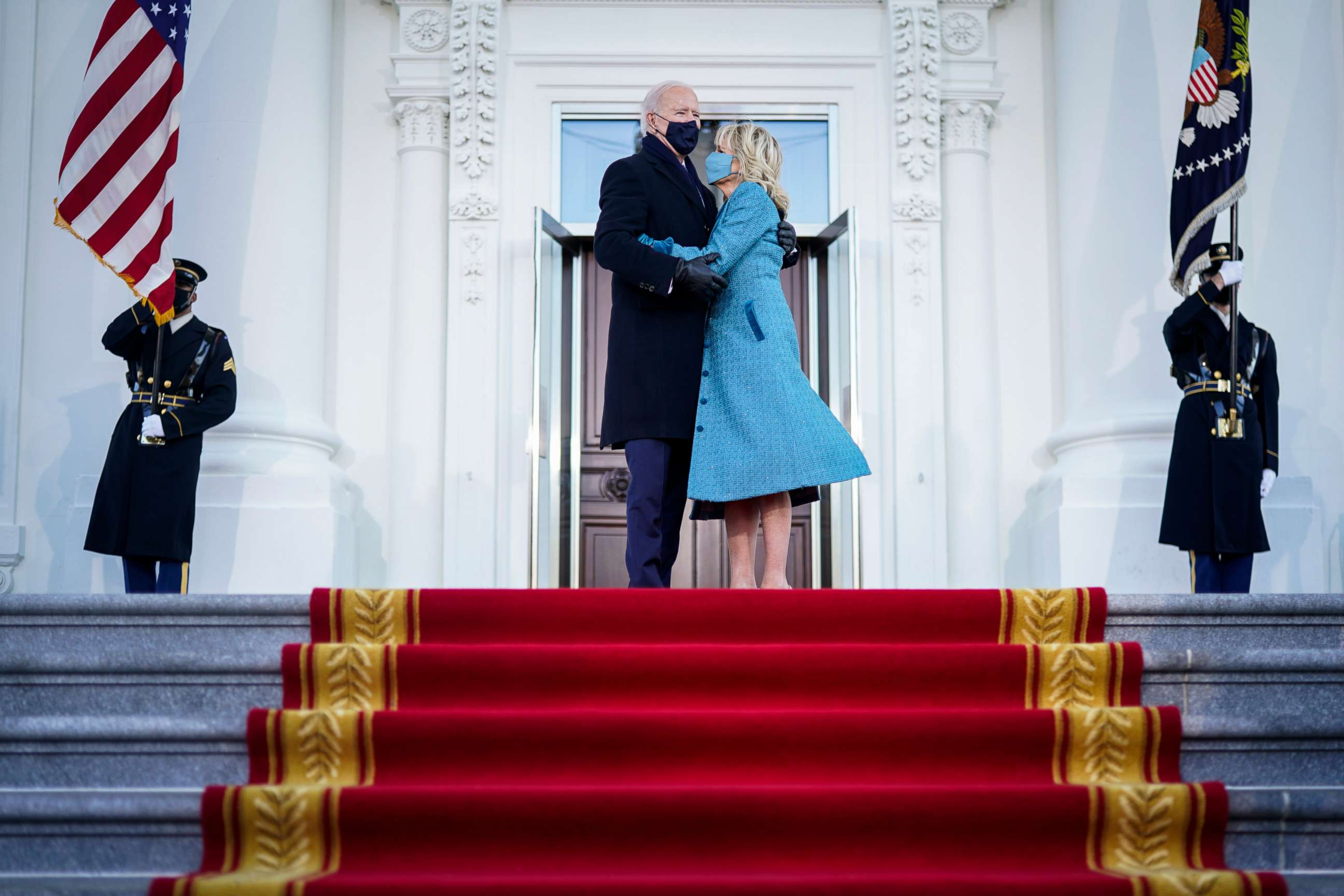 PHOTO: President Joe Biden and first lady Jill Biden hug at the entrance to the White House on Inauguration day, Jan. 20, 2021, in Washington.