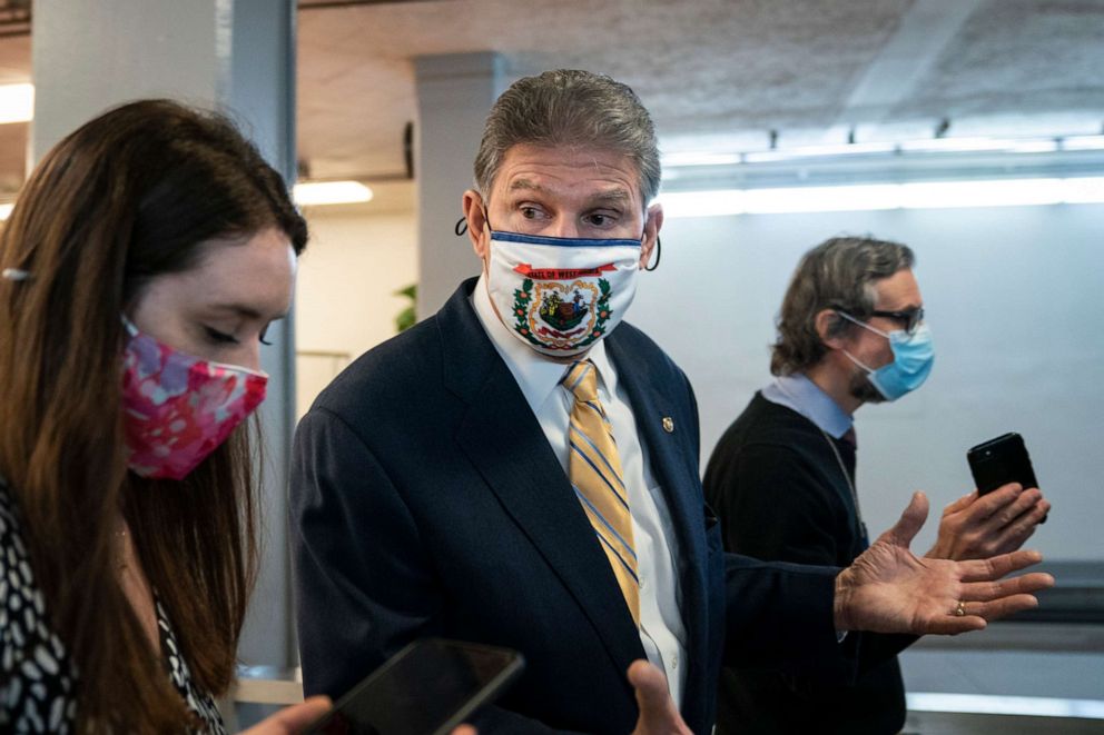 PHOTO: Sen. Joe Manchin speaks to reporters in the Senate subway following a vote at the U.S. Capitol on Feb. 2, 2021, in Washington, D.C.