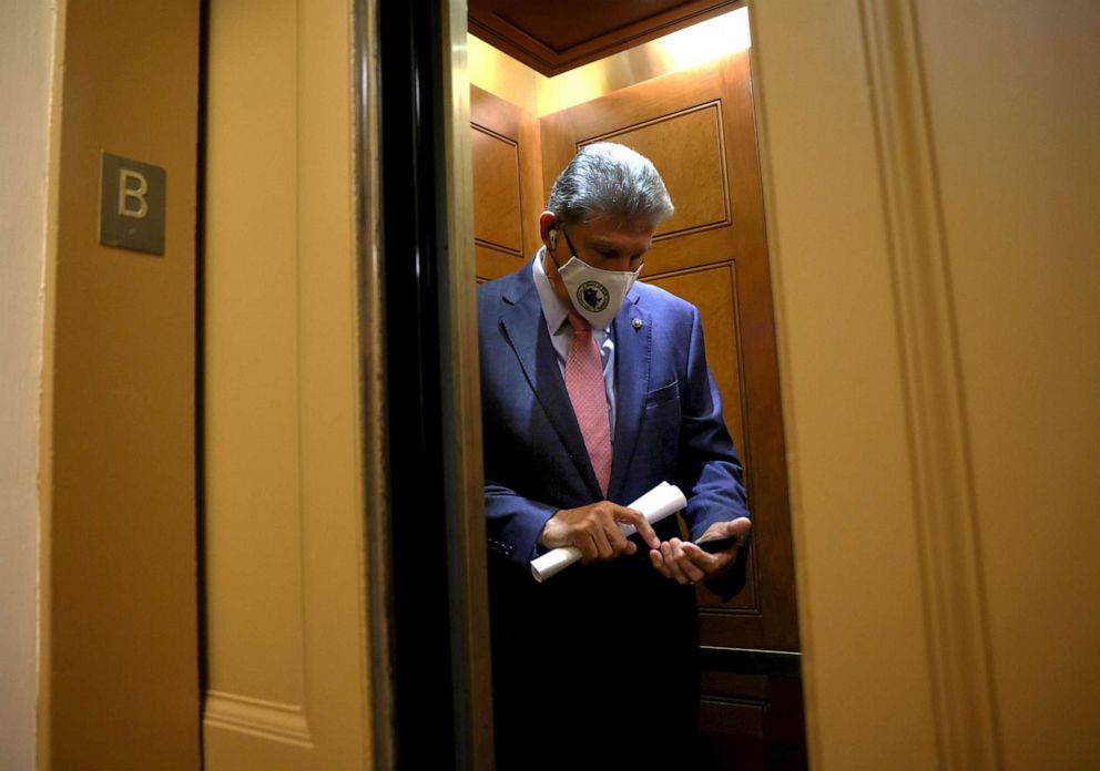 PHOTO: Sen. Joe Manchin enters an elevator at the U.S. Capitol, Sept. 22, 2021, in Washington, DC.