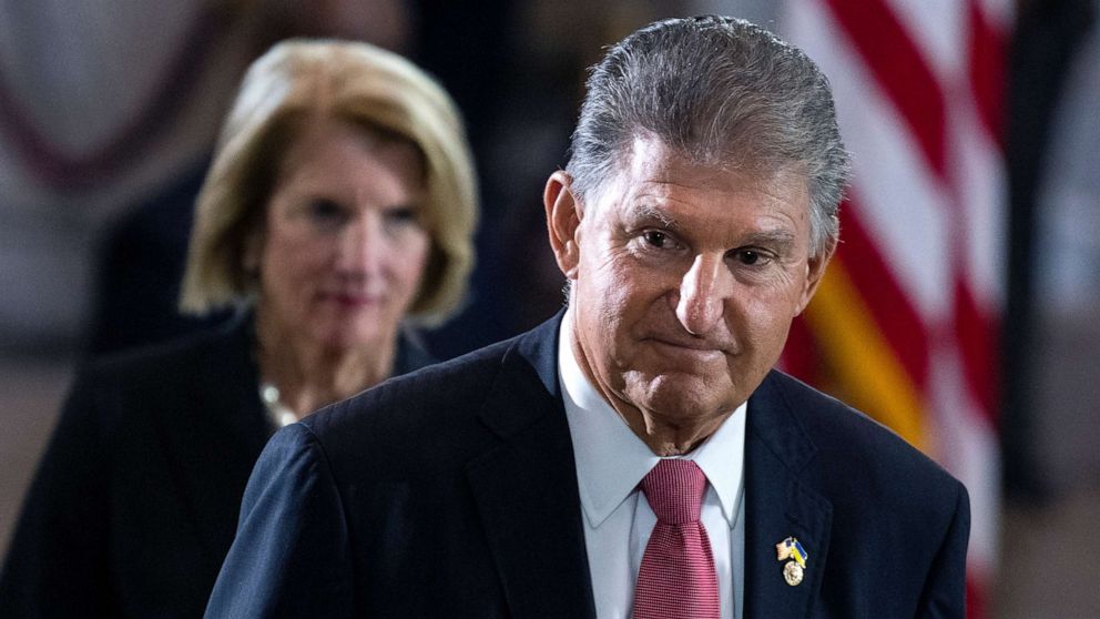 PHOTO: Sen. Joe Manchin and Sen. Shelley Moore Capito pay respects to Hershel Woodrow Woody Williams in the United States Capitol Rotunda during a Congressional tribute ceremony on July 14, 2022, in Washington, D.C. 