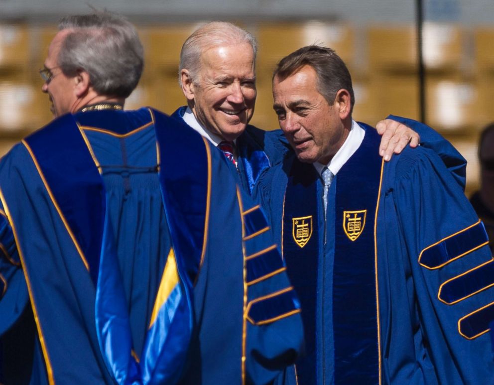 PHOTO: Joe Biden and former House Speaker John Boehner, right, share a moment as they take the stage for the University of Notre Dame Commencement Ceremony on May 15, 2016, inside Notre Dame Stadium in South Bend, Ind.