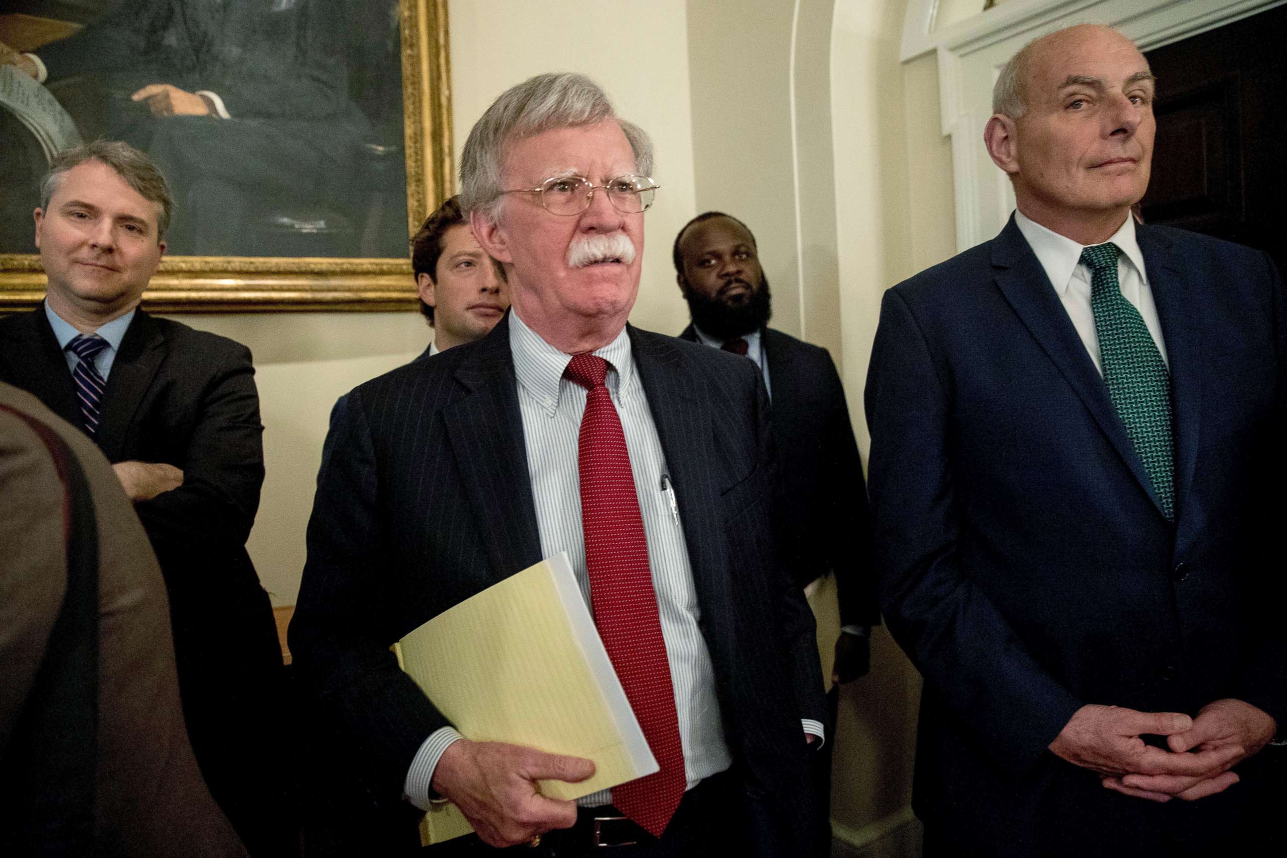 PHOTO: National security adviser John Bolton, center, and President Donald Trump's chief of staff John Kelly, right, attend a meeting with President Donald Trump and members of Congress in the Cabinet Room of the White House, July 17, 2018, in Washington.