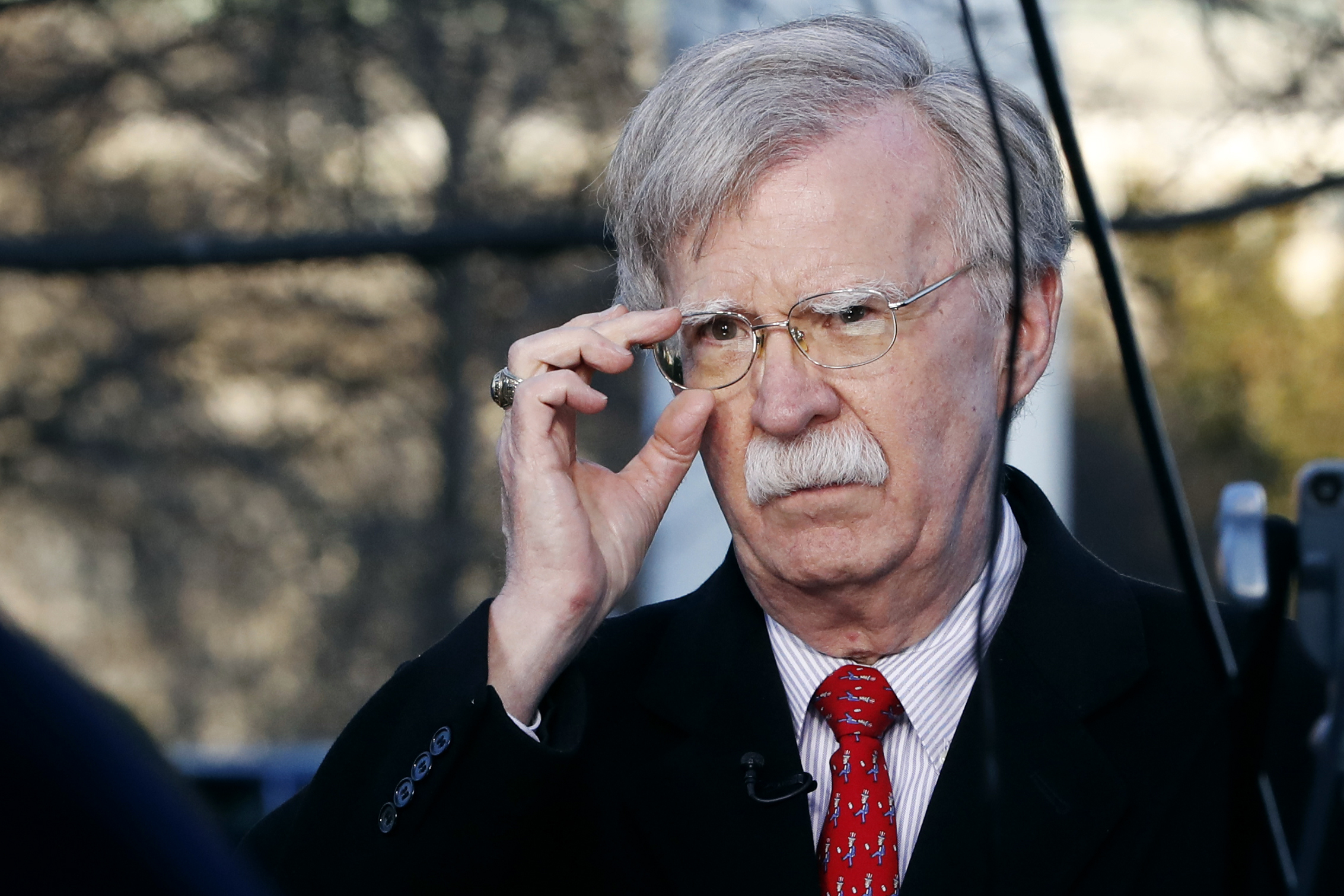 PHOTO: National security adviser John Bolton adjusts his glasses before an interview at the White House in Washington, March 5, 2019.