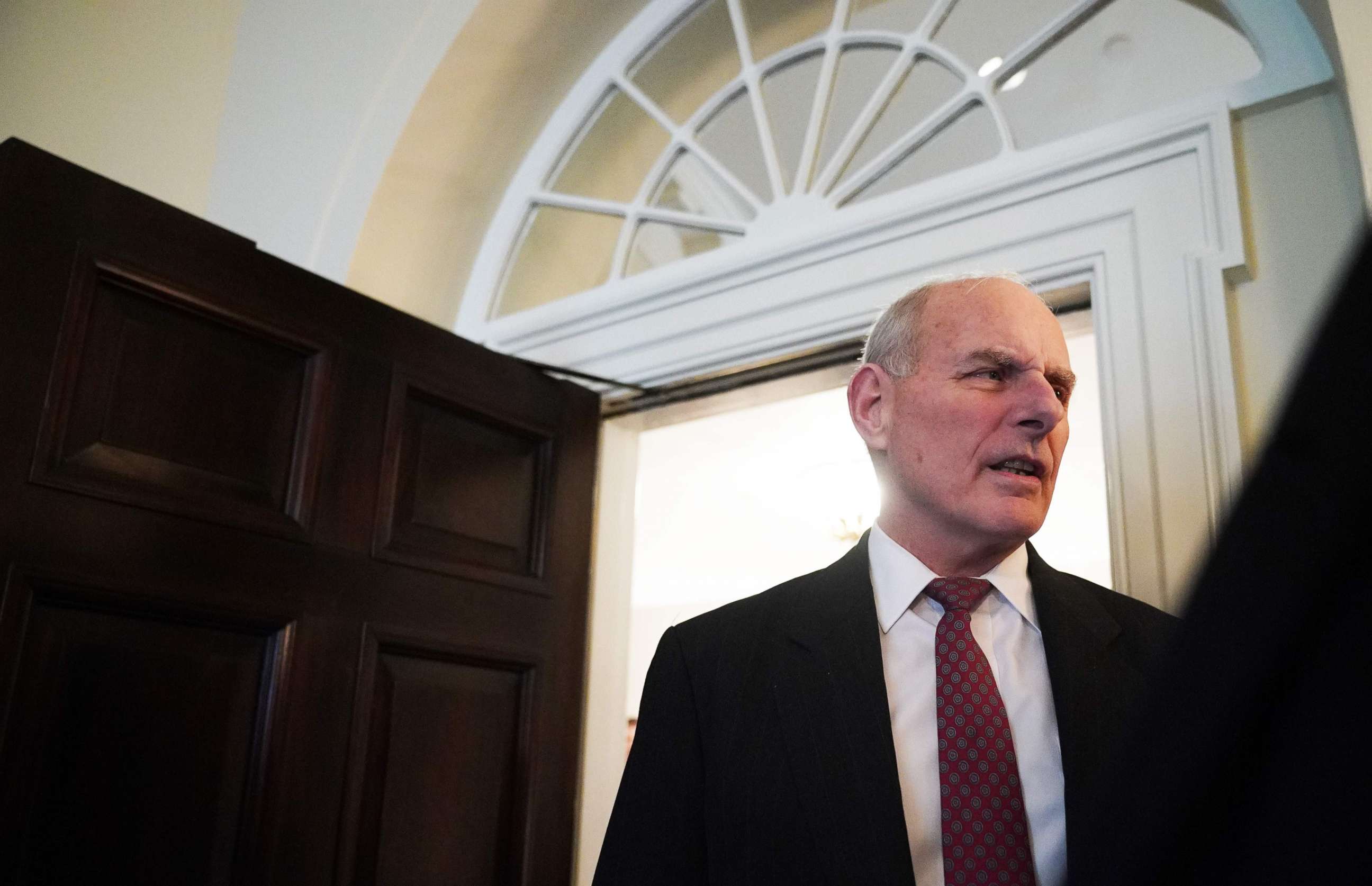 PHOTO: White House Chief of Staff John Kelly chats with reporters before a roundtable discussion on the MS-13 gang in the Cabinet Room of the White House, Feb. 6, 2018.