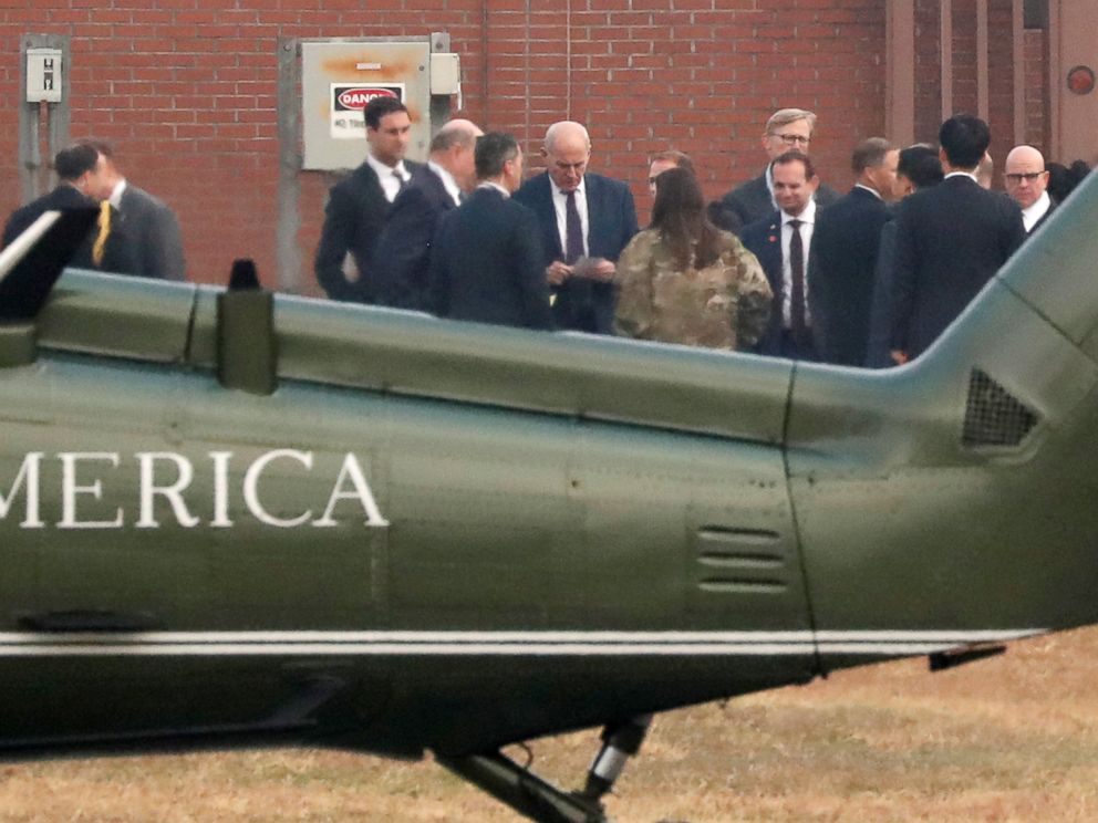 PHOTO: White House Chief of Staff John Kelly looks at notes while huddling with White House senior staff to discuss the situation after being grounded from an attempt to visit the DMZ, at a U.S. military post in Seoul, South Korea, Nov. 8, 2017.