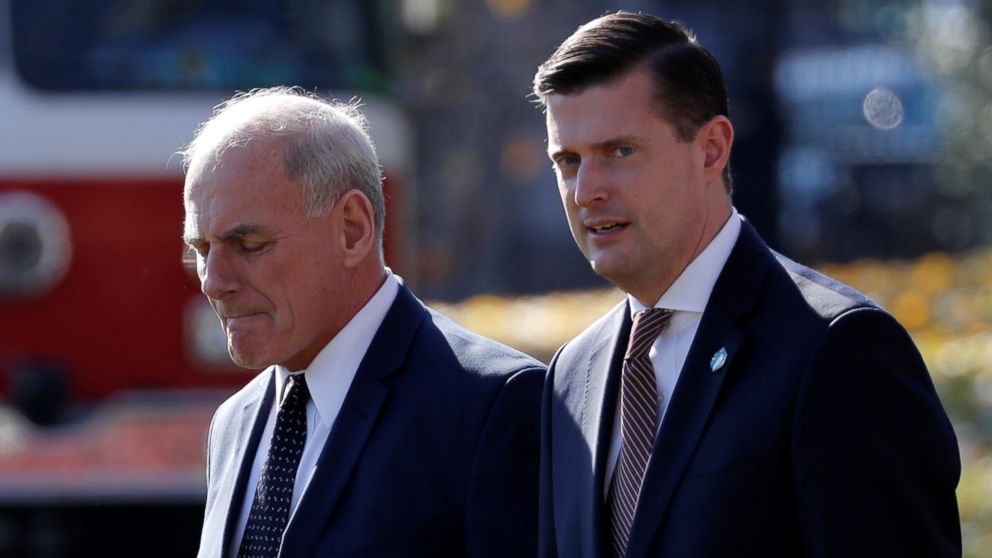 White House Chief of Staff John Kelly walks with White House Staff Secretary Rob Porter in Washington, Nov. 29, 2017.