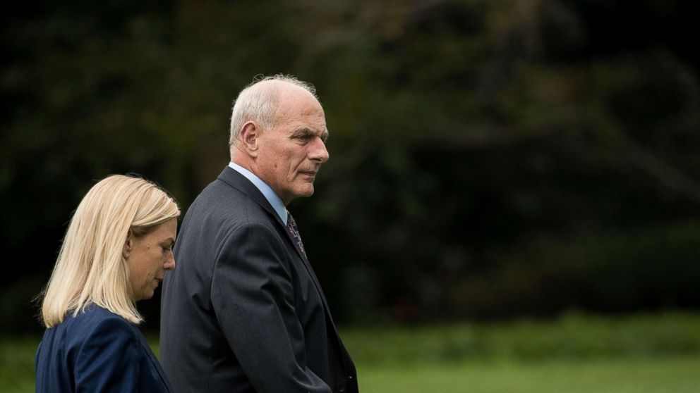 White House Chief of Staff John Kelly walks with Kirstjen Nielsen on the South Lawn of the White House, Oct. 13, 2017. 