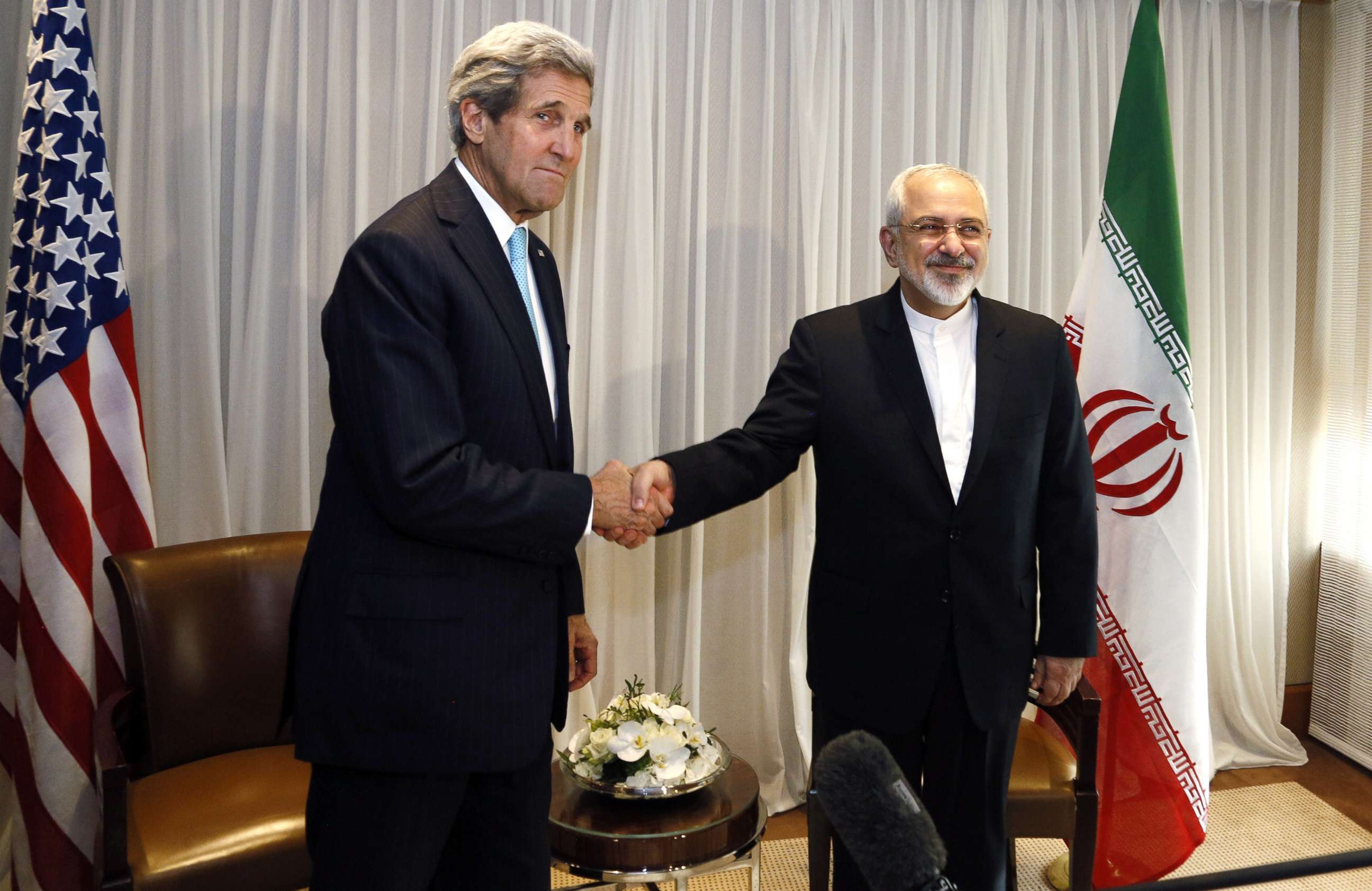 PHOTO: Iranian Foreign Minister Mohammad Javad Zarif shakes hands with then-U.S. Secretary of State John Kerry in Geneva, Jan. 14, 2015.