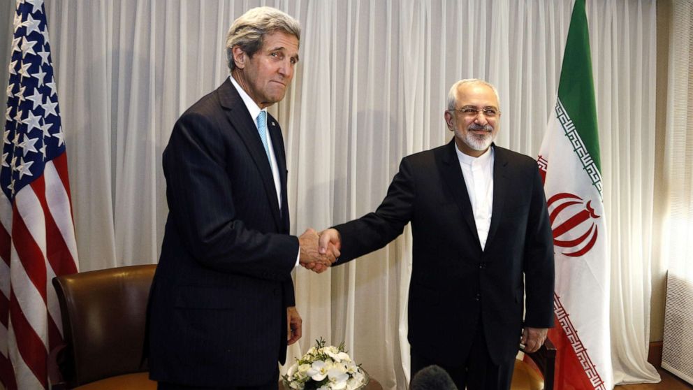 PHOTO: Iranian Foreign Minister Mohammad Javad Zarif shakes hands with then-U.S. Secretary of State John Kerry in Geneva, Jan. 14, 2015.