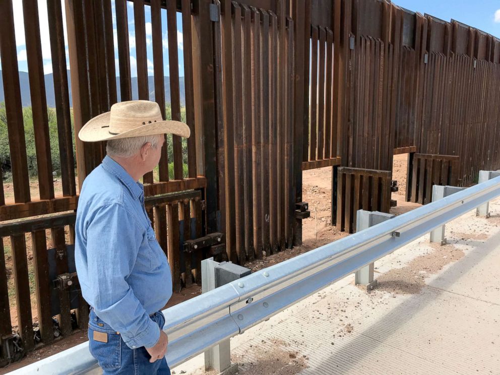 PHOTO: John Ladd says that the swing gates that were added to higher portions of the wall are intended to help stop build up against the wall during flash floods but they tend to be left open for days.