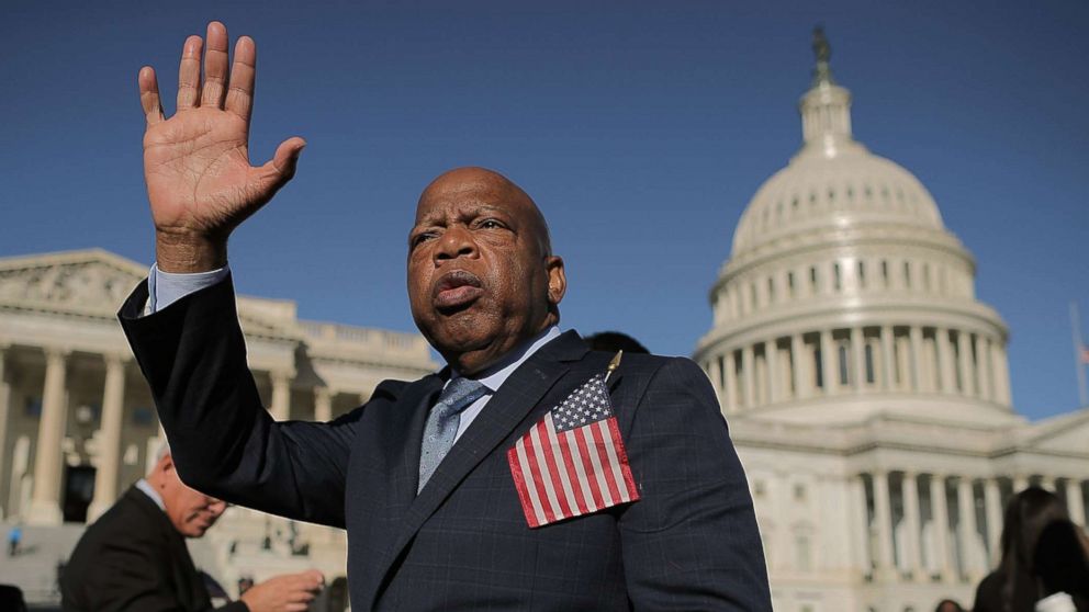 Rep. John Lewis waves as he thanks anti-gun violence supporters following a rally with fellow Democrats on the East Front steps of the U.S. House of Representatives Oct. 4, 2017 in Washington, DC.