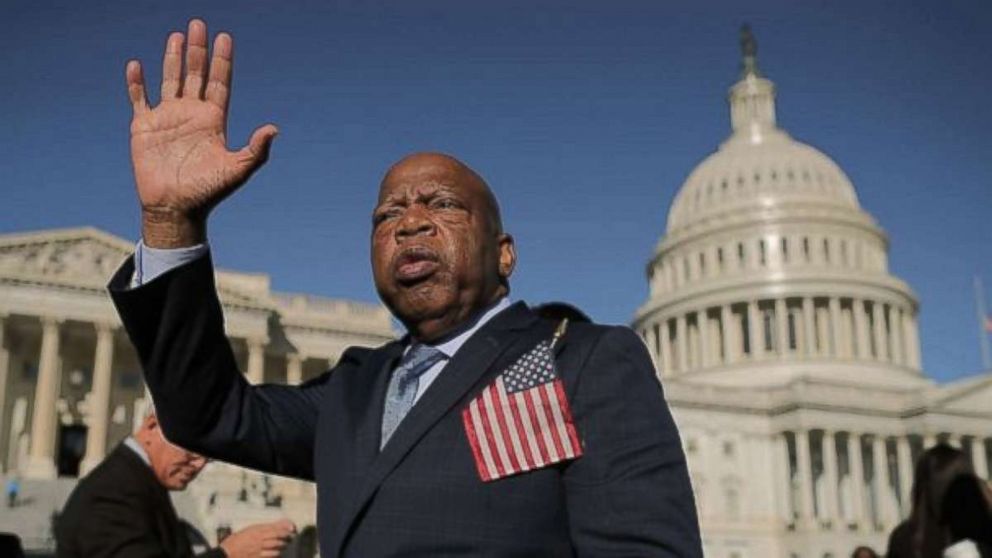 Rep. John Lewis waves as he thanks anti-gun violence supporters following a rally with fellow Democrats on the East Front steps of the U.S. House of Representatives Oct. 4, 2017 in Washington, DC.