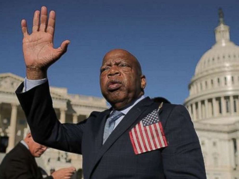 Rep. John Lewis waves as he thanks anti-gun violence supporters following a rally with fellow Democrats on the East Front steps of the U.S. House of Representatives Oct. 4, 2017 in Washington, DC.