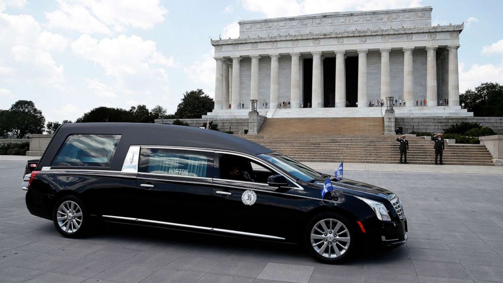 PHOTO: A hearse with the flag-draped casket of Rep. John Lewis pauses in front of the Lincoln Memorial, July 27, 2020, in Washington.
