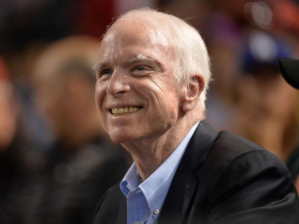 PHOTO: Sen. John McCain smiles while attending a baseball game between the Los Angeles Dodgers and Arizona Diamondbacks at Chase Field on Aug. 10, 2017 in Phoenix.