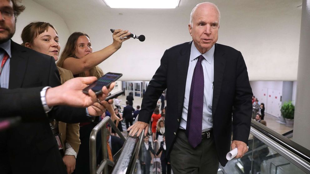 Sen. John McCain is pursued by reporters as he heads for a vote at the U.S. Capitol, September 6, 2016, in Washington, DC. Sen. John McCain, who last Friday had surgery to remove a blood clot above his left eye, has been diagnosed with brain cancer, according to published reports today.