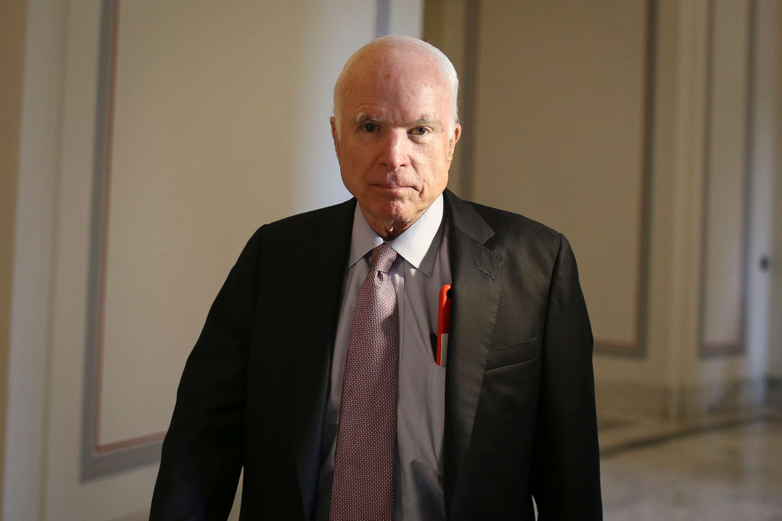 PHOTO: Sen. John McCain walks outside of his office in the Russell Senate Office Building on Sep. 5, 2017 in Washington, D.C.