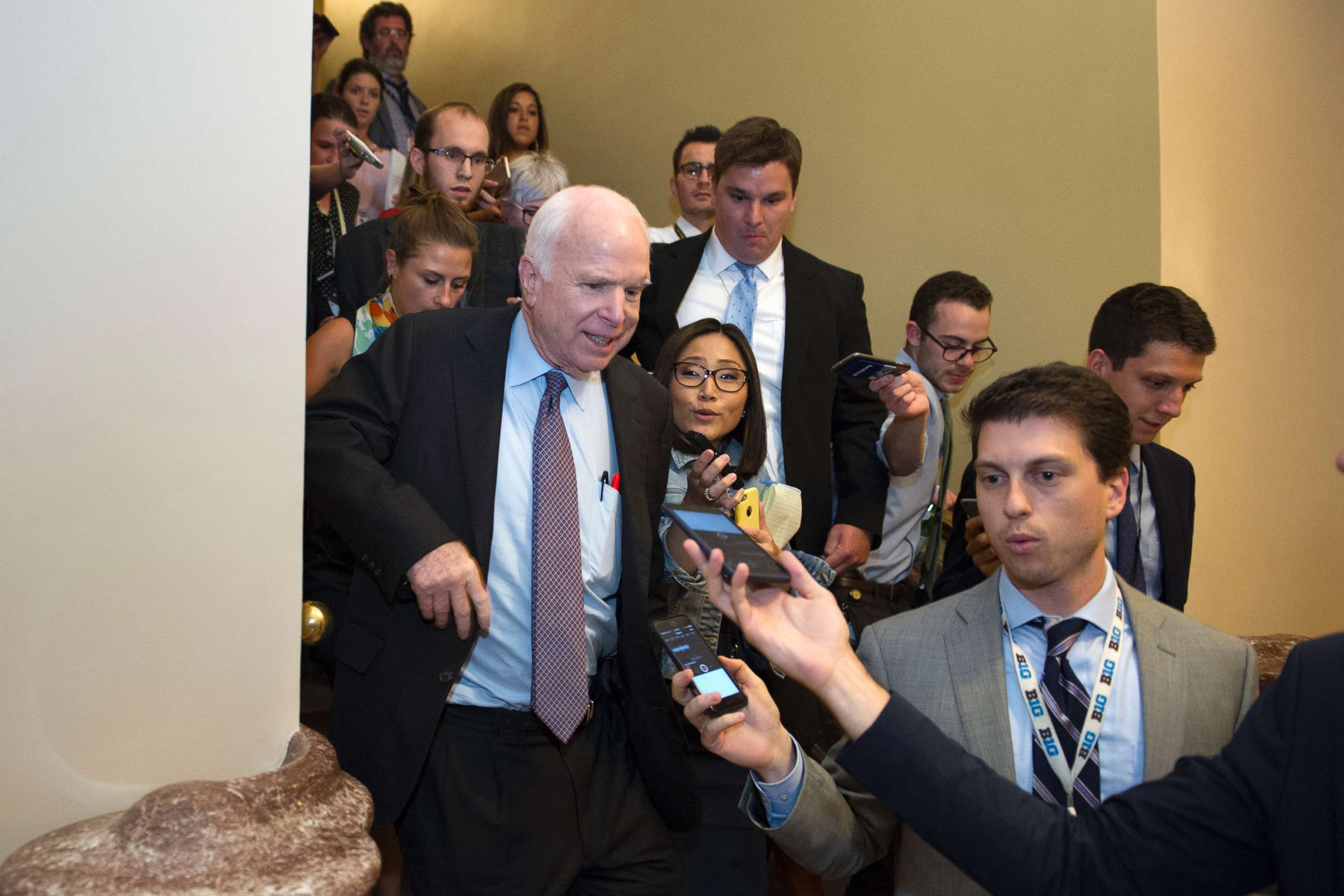 PHOTO: Sen. John McCain, front left, is pursued by reporters after casting a "no" vote on a measure to repeal parts of former President Barack Obama's health care law, on Capitol Hill in Washington, July 28, 2017.