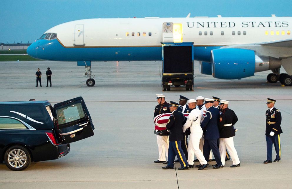 PHOTO: Members of the military carry the flag-draped casket of the late U.S. Senator John McCain, after arriving on a military airplane at Joint Base Andrews in Md., Aug. 30, 2018.