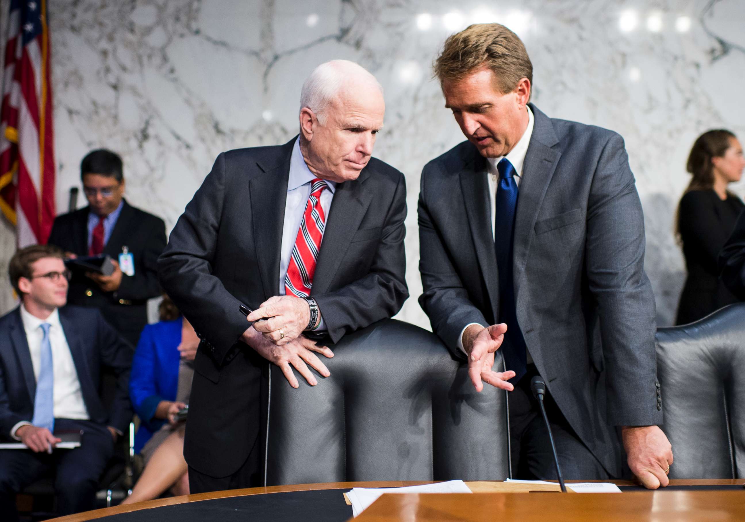PHOTO: Sen. John McCain, left, and Sen. Jeff Flake, talk before the start of the Senate Foreign Relations hearing to debate the authorization for use of military force in Syria, Sept. 3, 2013.