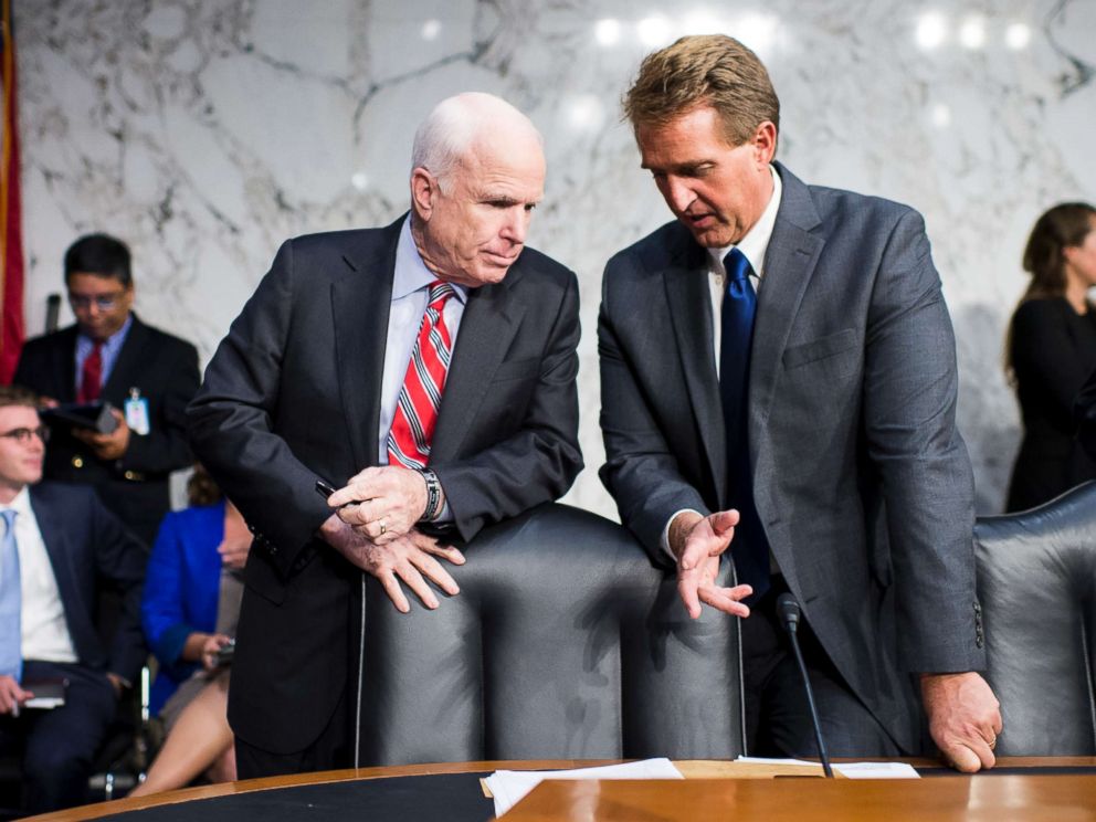 PHOTO: Sen. John McCain, left, and Sen. Jeff Flake, talk before the start of the Senate Foreign Relations hearing to debate the authorization for use of military force in Syria, Sept. 3, 2013.