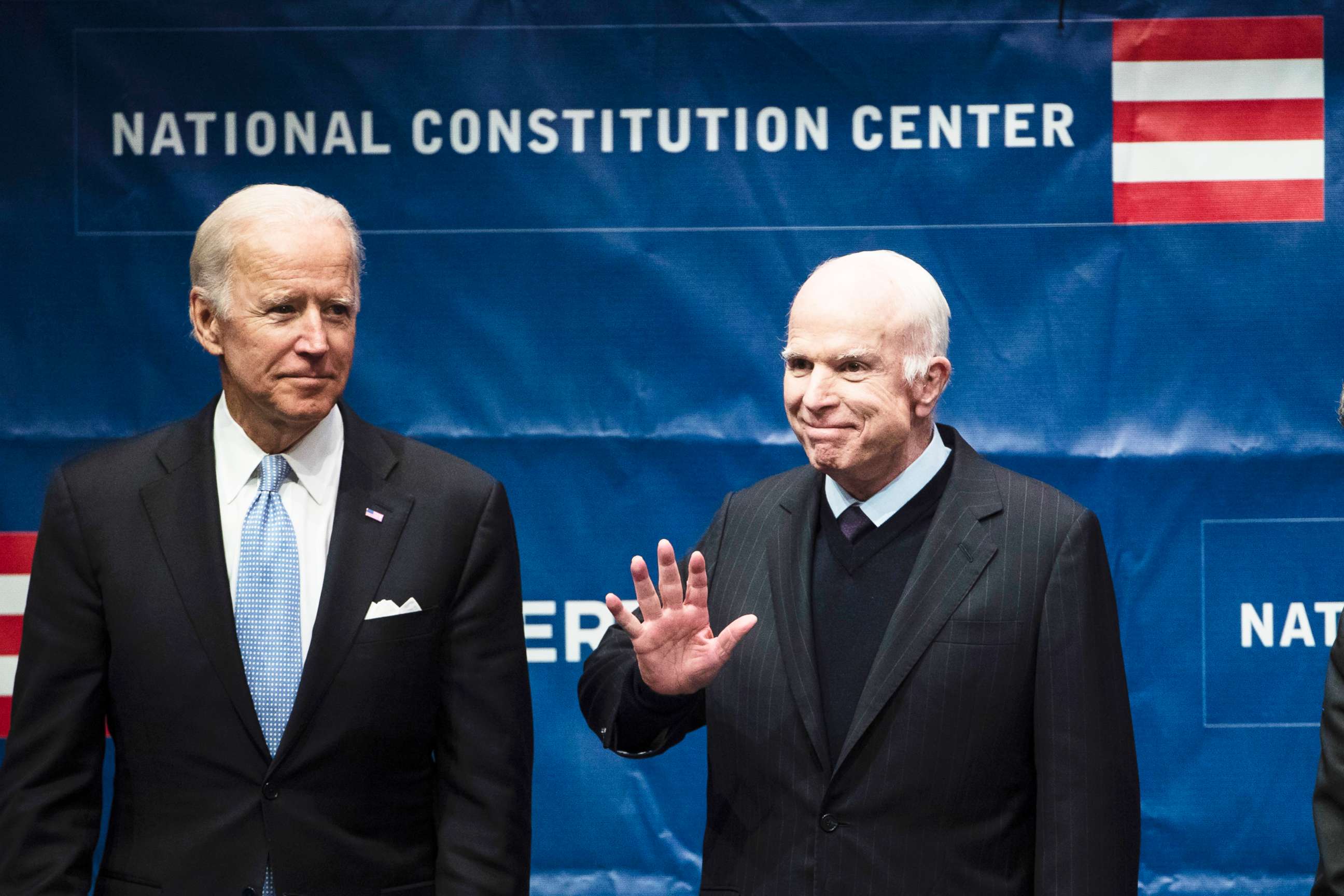 PHOTO: Sen. John McCain, right, accompanied by Chair of the National Constitution Center's Board of Trustees, former Vice President Joe Biden, waves as he takes the stage before receiving the Liberty Medal in Philadelphia, Oct. 16, 2017.