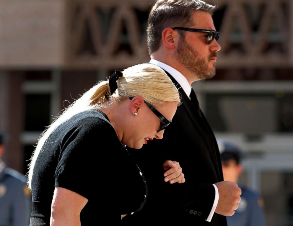 PHOTO: Meghan McCain cries as she and her husband Ben Domenech follow behind the casket carrying her father Sen. John McCain as they arrive for a memorial service, Aug. 29, 2018, at the Capitol in Phoenix.