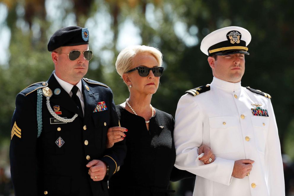 PHOTO: Cindy McCain arrives for a memorial service for Sen. John McCain, R-Ariz. at the Arizona Capitol, Aug. 29, 2018, in Phoenix, escorted by her sons Jimmy, left, and Jack.