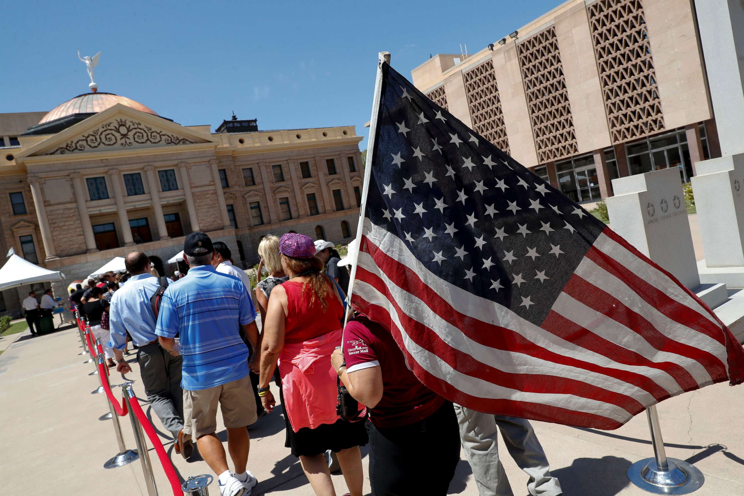 PHOTO: Members of the public line up to pay their respects for Sen. John McCain during a viewing at the Arizona Capitol, Aug. 29, 2018, in Phoenix.