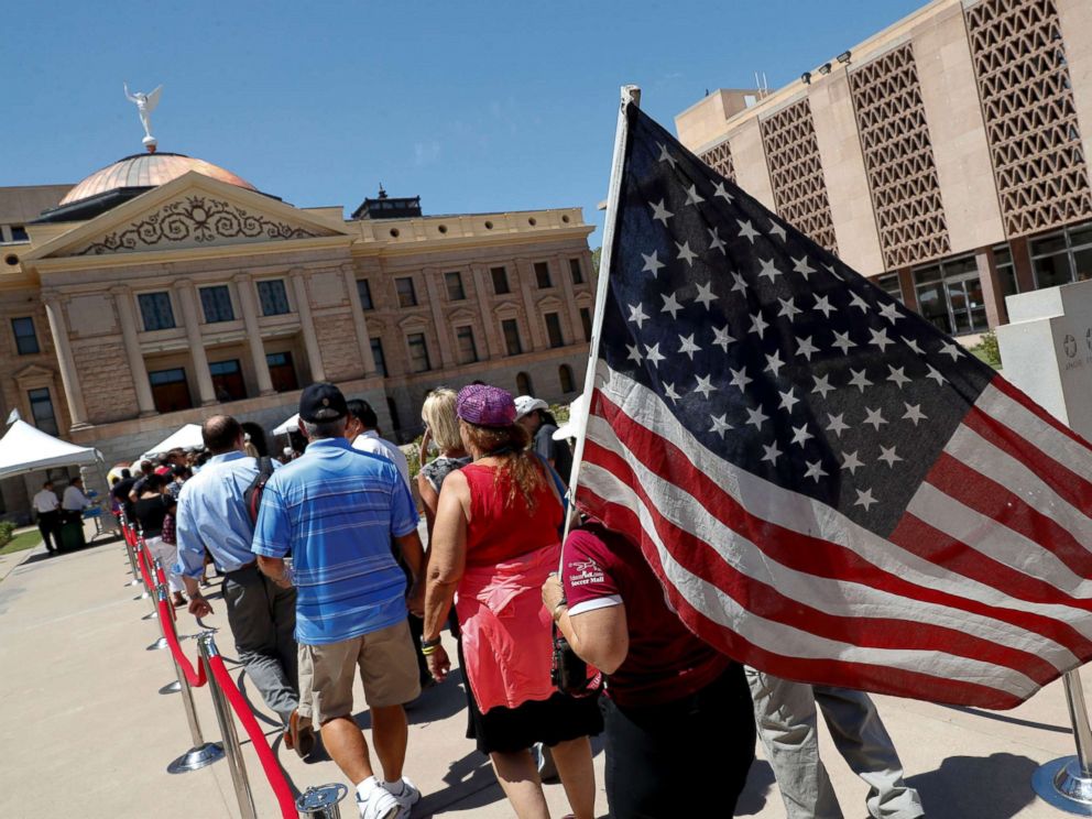 PHOTO: Members of the public line up to pay their respects for Sen. John McCain during a viewing at the Arizona Capitol, Aug. 29, 2018, in Phoenix.