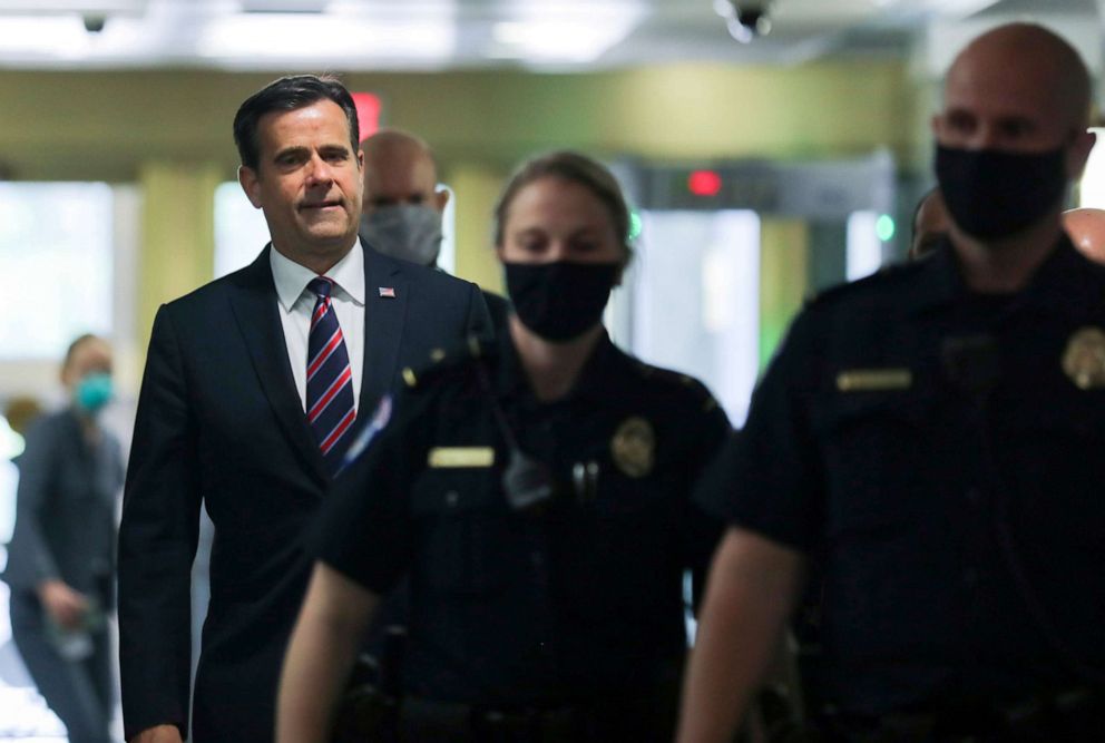 PHOTO: Rep. John Ratcliffe, President Donald Trump's nominee to be Director of National Intelligence, is escorted by Capitol police officers wearing face masks as he arrives to testify at his U.S. Senate confirmation hearing in Washington, May 5, 2020.