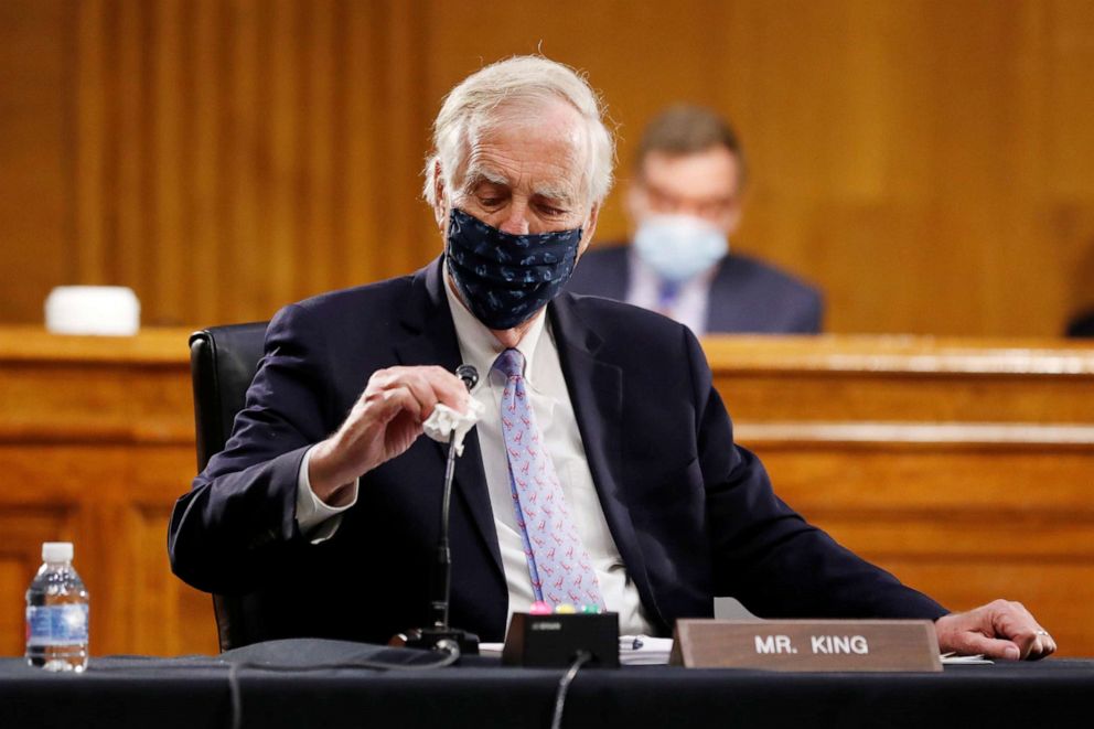 PHOTO: Sen. Angus King wipes his microphone as he arrives for a Senate Intelligence Committee nomination hearing for Rep. John Ratcliffe, on Capitol Hill in Washington, May 5, 2020.