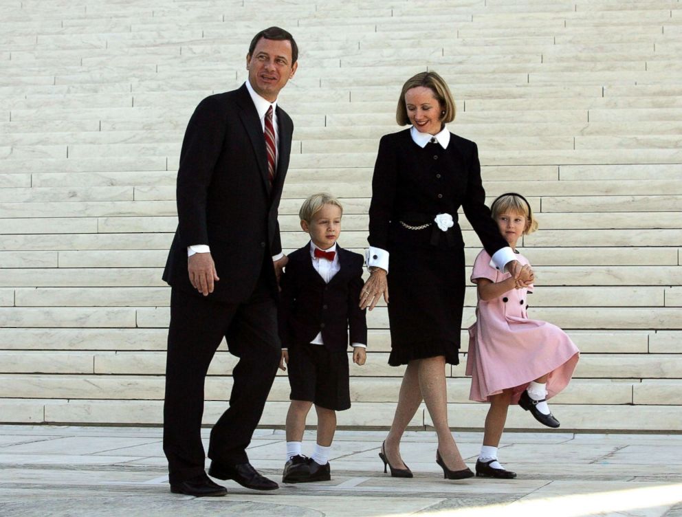 PHOTO: Chief Justice John Roberts walks with his wife Jane Roberts and their children at the Supreme Court after he took the Supreme Court bench for the first time October 3, 2005 in Washington.