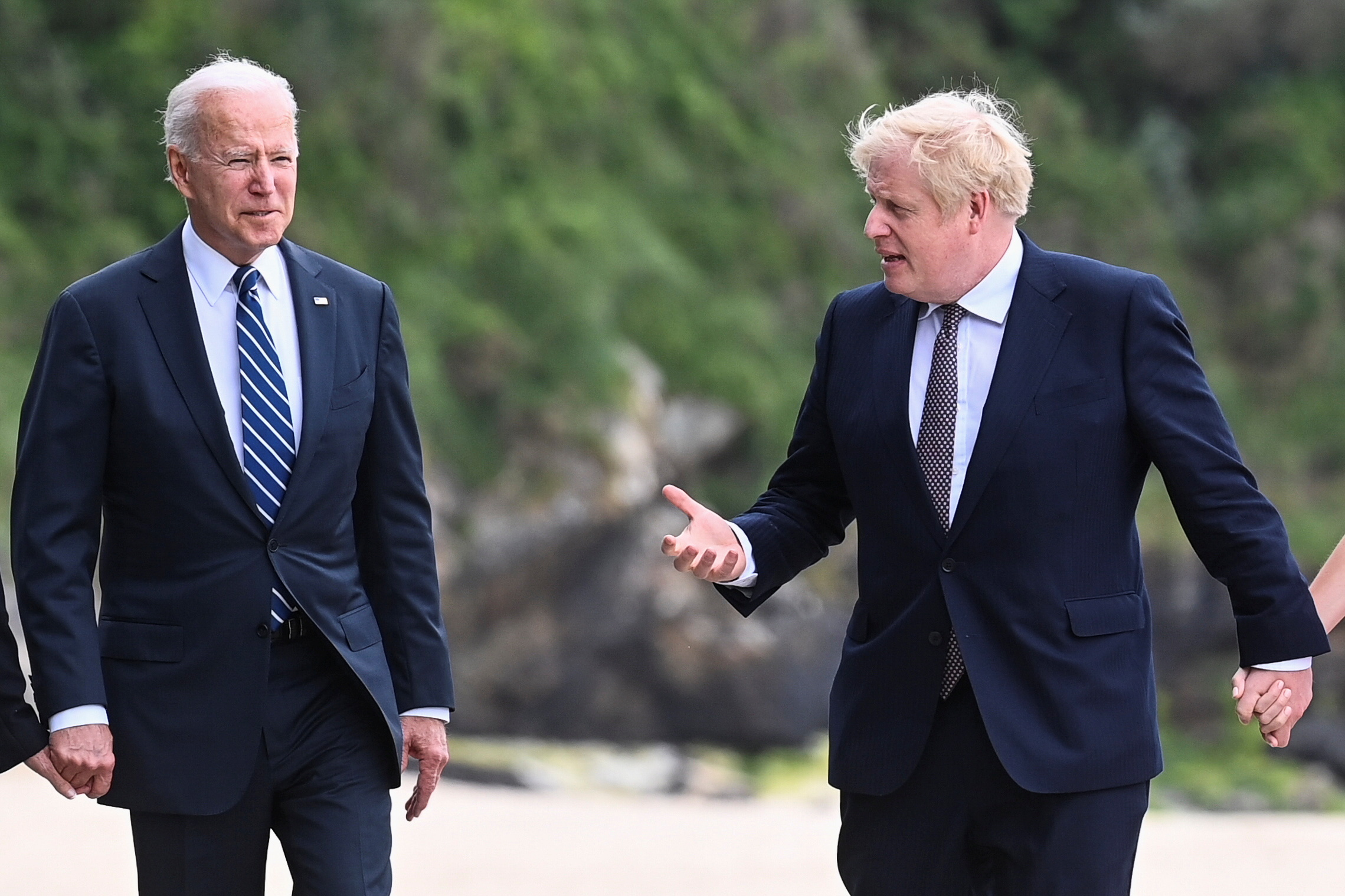 PHOTO: Britain's Prime Minister Boris Johnson speaks with U.S. President Joe Biden while they walk outside Carbis Bay Hotel, Carbis Bay, Cornwall, Britain, June 10, 2021.