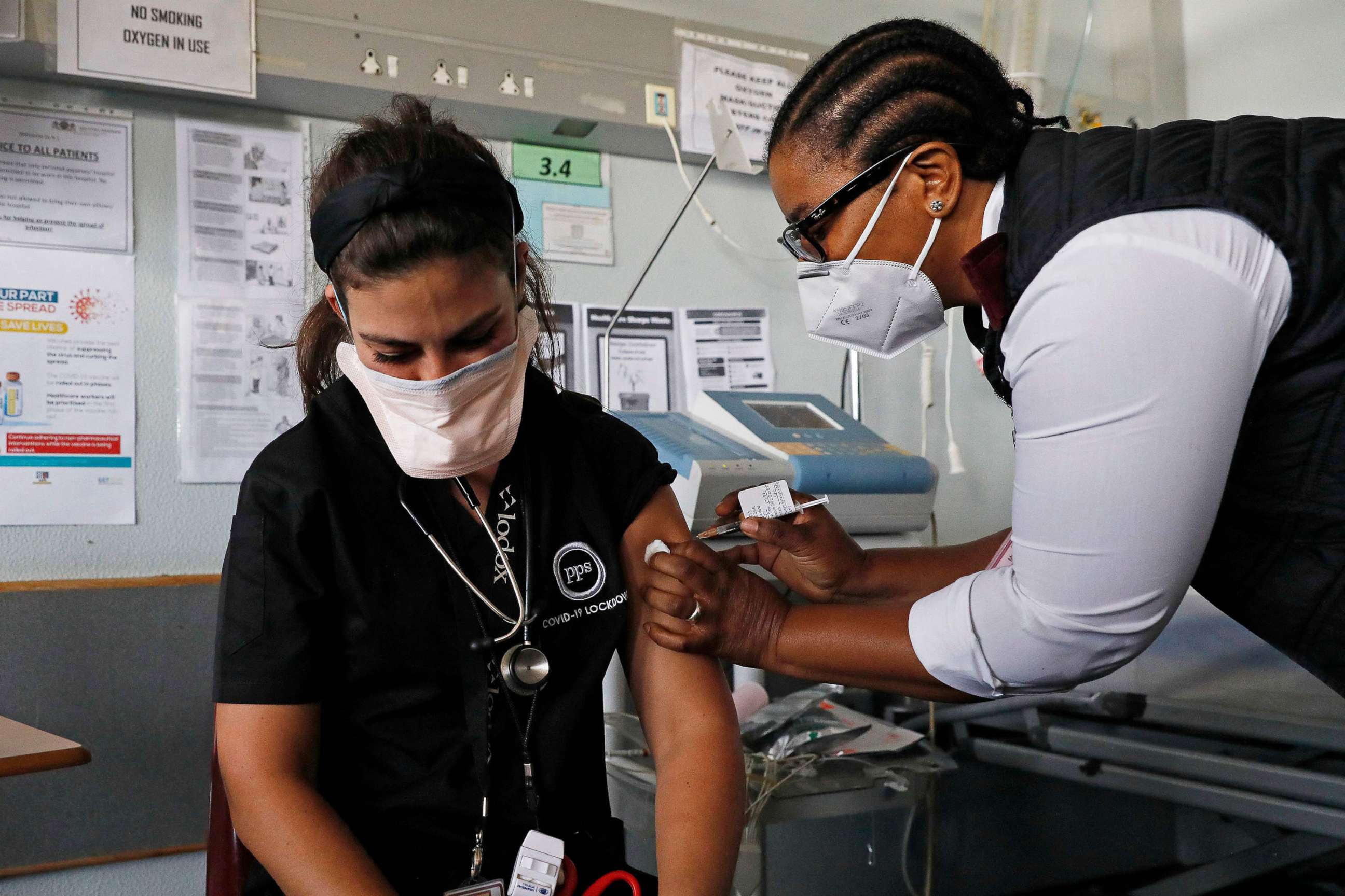 PHOTO: Doctor Anike Baptiste receives a dose of the Johnson & Johnson vaccine against the COVID-19 coronavirus from Mokgadi Malebye, a professional nurse at the Steve Biko Academic Hospital in Pretoria on Feb. 17, 2021.