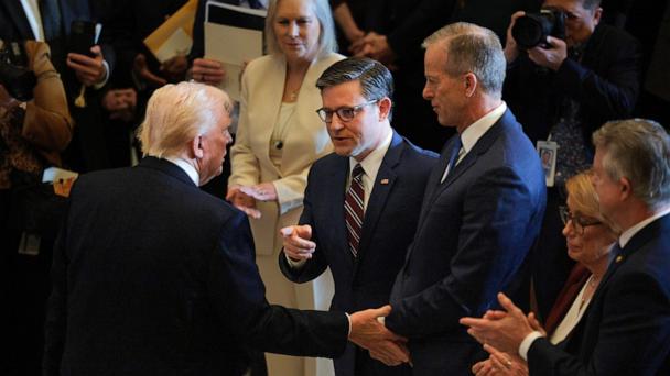 President Donald Trump shakes hands with House Speaker Rep. Mike Johnson and Senate Majority Leader John Thune after  the National Prayer Breakfast in Statuary Hall at the U.S. Capitol on February 06, 2025 in Washington, DC.