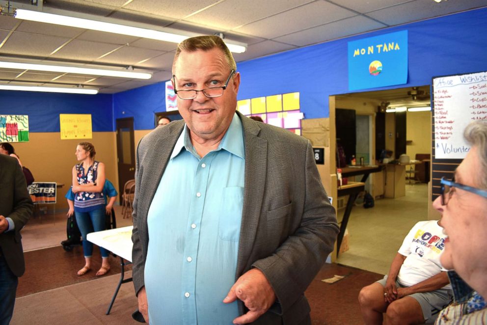 PHOTO: U.S. Sen. Jon Tester speaks with a supporter during an event at the Tester campaign headquarters in Billings, Mont., June 8, 2018.