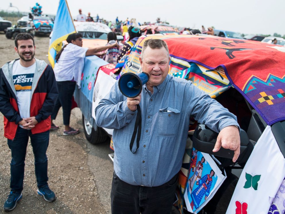 PHOTO: Sen. Jon Tester addresses constituents before a parade at Crow Fair in Crow Agency, Mont., Aug. 19, 2018.