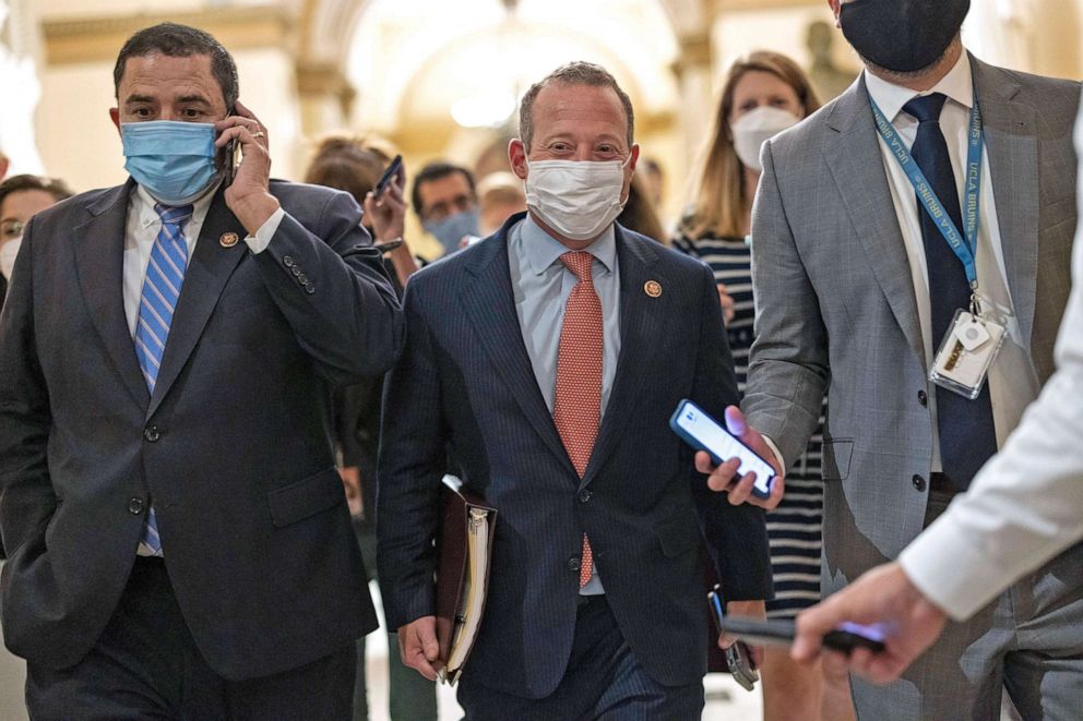 PHOTO: Rep. Josh Gottheimer and Rep. Henry Cuellar walk to the office of House Speaker Nancy Pelosi at the Capitol on Aug. 23, 2021 in Washington, D.C. They are pressing Pelosi to pass the bipartisan infrastructure bill budget reconciliation bill.