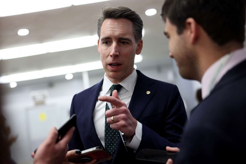 PHOTO: Sen. Josh Hawley talks to reporters on his way to the Senate weekly policy luncheons, at the U.S. Capitol on Dec. 6, 2022 in Washington, DC.