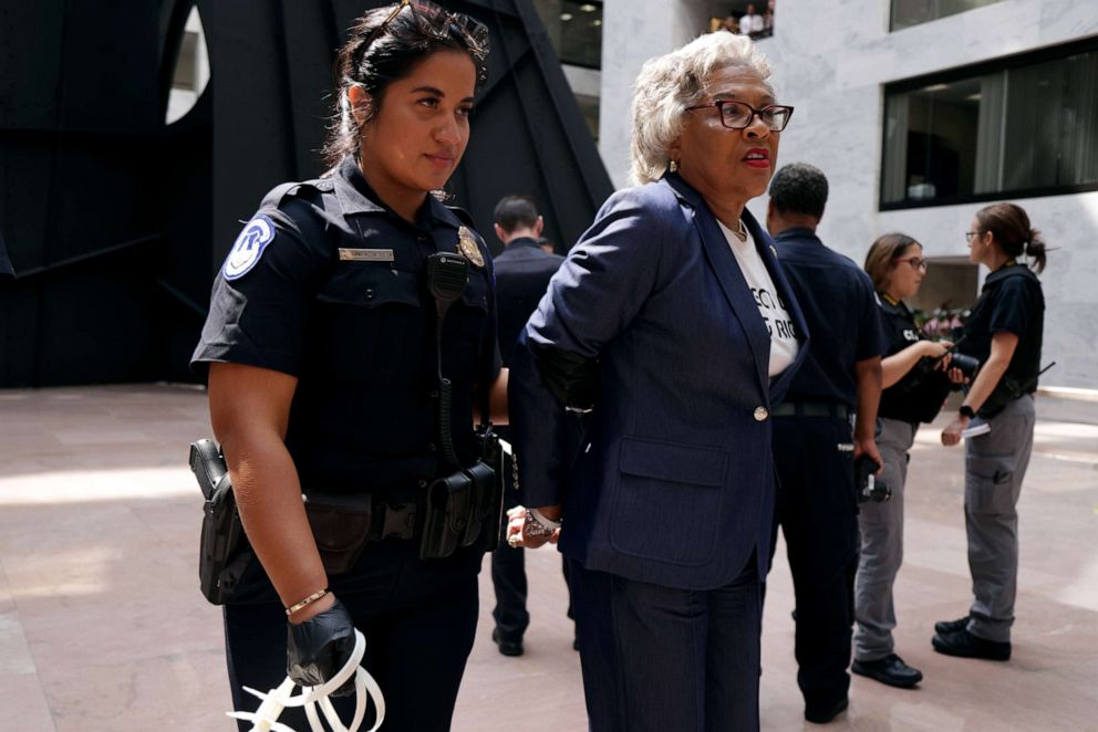 PHOTO: Rep. Joyce Beatty is led away by a member of the U.S. Capitol Police during a protest at Hart Senate Office Building, July 15, 2021, on Capitol Hill in Washington, DC.
