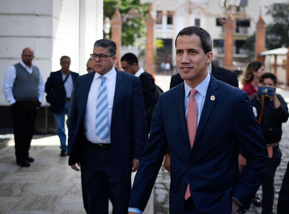PHOTO: Venezuelan opposition leader and self-proclaimed acting president Juan Guaido, right, arrives for an extraordinary session of the National Assembly, in Caracas on Dec. 17, 2019.