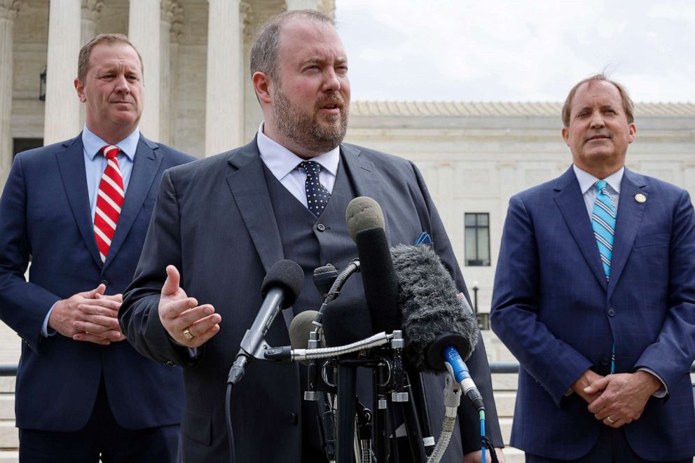 PHOTO: Texas Solicitor General Judd Stone talks to reporters along with Texas Attorney General Ken Paxton, right, and Missouri Attorney General Eric Schmitt, left, in front of the U.S. Supreme Court, April 26, 2022, in Washington, D.C.