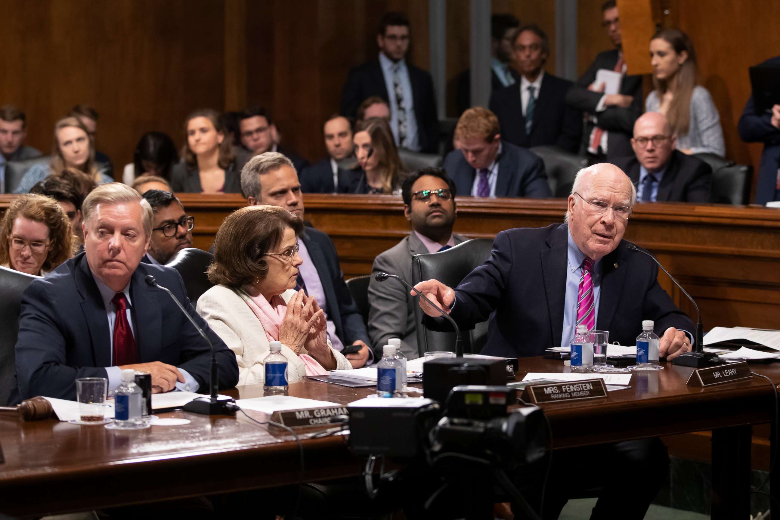PHOTO: Senate Judiciary Committee Chairman Lindsey Graham and Sen. Dianne Feinstein listen as Sen. Patrick Leahy charges Graham with breaking with normal rules of procedure.